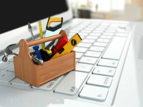 Online support. Toolbox with tools on laptop. Online support. Toolbox with tools on laptop.