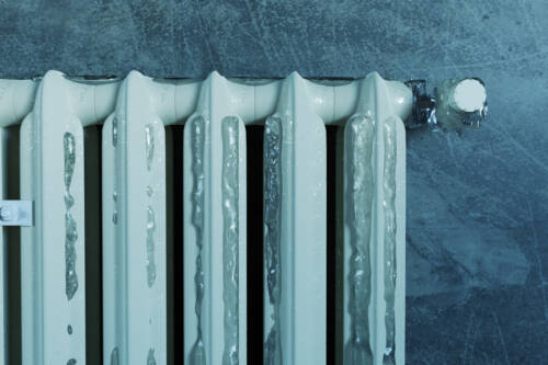 3d rendering of an old heat radiator covered with ice because of energy poverty 3d rendering of an old heat radiator covered with ice because of energy poverty