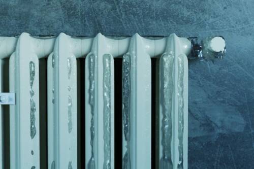 3d rendering of an old heat radiator covered with ice because of energy poverty 3d rendering of an old heat radiator covered with ice because of energy poverty