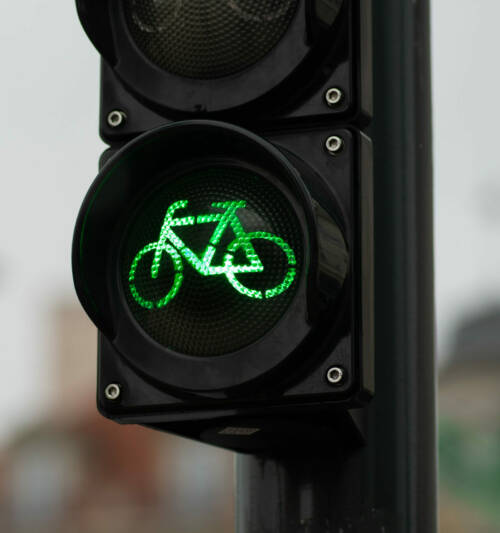 Sustainable transport. Bicycle traffic signal, green light, road Sustainable transport. Bicycle traffic signal, green light, road