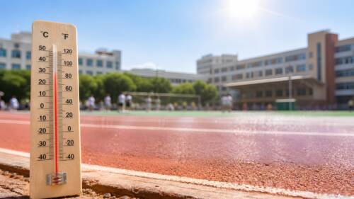 School sports track heatwave with thermometer under harsh sunlight School sports track heatwave with thermometer under harsh sunlight